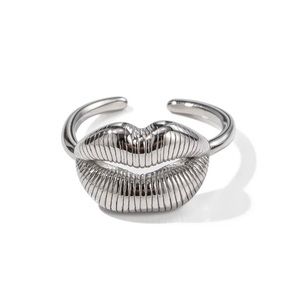 New 18k PVD plated, stainless steel adjustable lip design ring. Silver color.